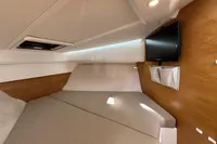 2019 Nimbus W 9 cabin interior with bed, TV, and wooden accents.