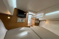 Interior of 2019 Nimbus W 9 boat cabin with bed, TV, and modern lighting.