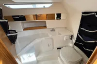 Compact bathroom in 2019 Nimbus W 9 boat with sink, toilet, and storage.