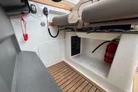 2019 Nimbus W 9 boat interior with control panel, fire extinguisher, and seating.