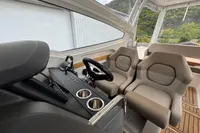 Interior of 2019 Nimbus W 9 boat, featuring modern helm and comfortable seating.