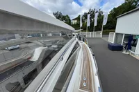 2019 Nimbus W 9 yacht with Lake Constance registration, docked near a marina building.