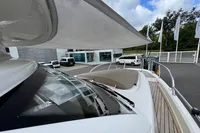 2019 Nimbus W 9 yacht with Lake Constance registration, docked near modern buildings.