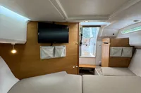 Interior of 2019 Nimbus W 9 boat with TV, seating, and storage.