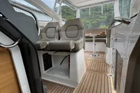 Interior of 2019 Nimbus W 9 boat with modern seating and wooden flooring.