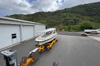 Nimbus W 9 boat on trailer, Lake Constance registration, 2019 model, scenic mountain backdrop.