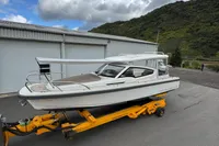 2019 Nimbus W 9 boat on trailer, Lake Constance registration, parked near industrial building.