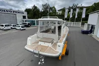 2019 Nimbus W 9 boat at dealership, Lake Constance registration, parked near Volvo Penta building.