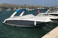2019 Regal 26 FasDeck boat docked in a marina with scenic background.