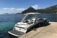 2019 Regal 26 FasDeck boat docked by scenic mountain lake.