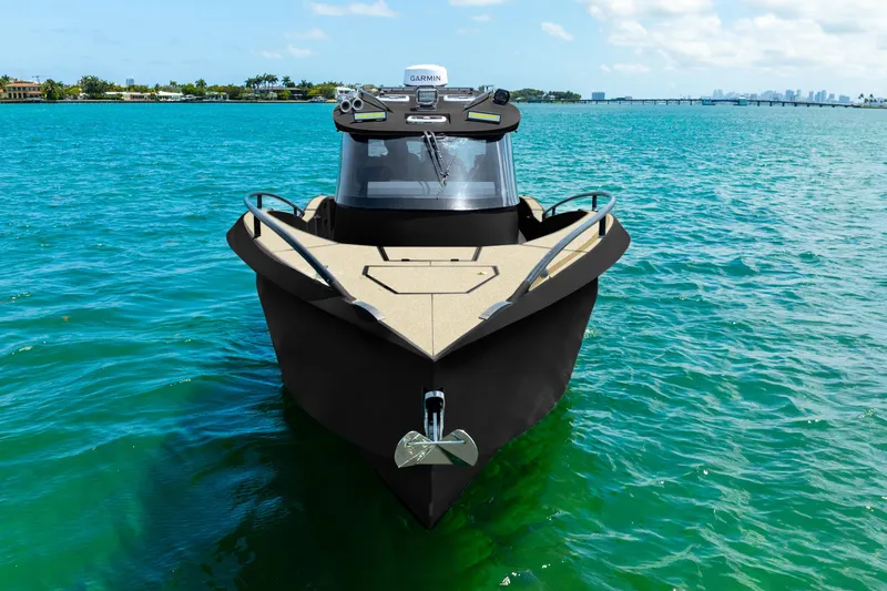  Yacht Photos Pics Front view of 2025 Novielli SERE boat on clear blue water.