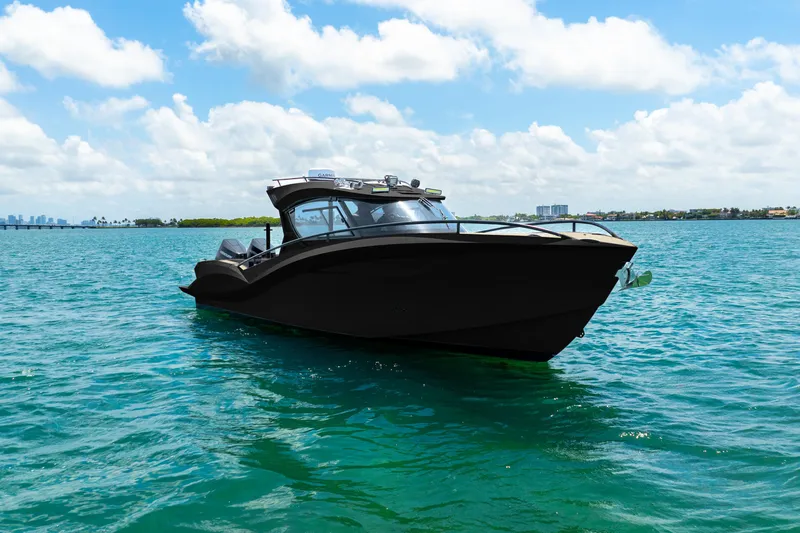  Yacht Photos Pics Luxury Novielli SERE 2025 boat on clear blue water under a sunny sky.