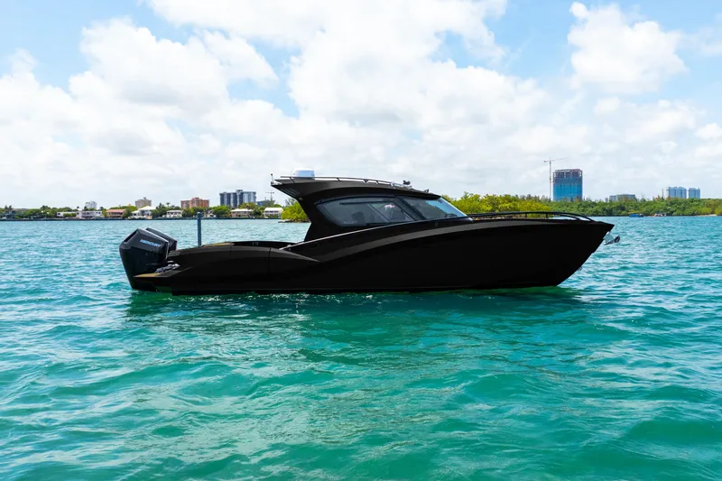  Yacht Photos Pics 2025 Novielli SERE boat on turquoise water under blue sky.