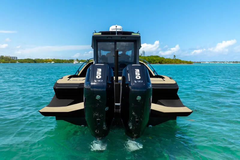  Yacht Photos Pics 2025 Novielli SERE boat with dual Mercury V10 engines on clear blue water.