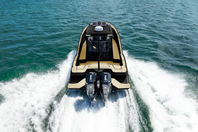  Yacht Photos Pics Novielli SERE 2025 boat cruising on open water with dual outboard engines.