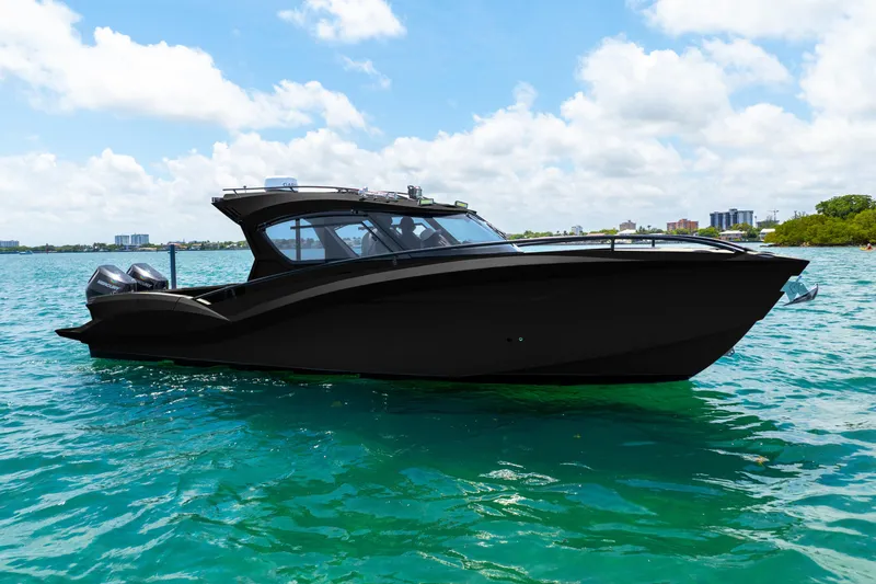  Yacht Photos Pics 2025 Novielli SERE boat on clear blue water under a sunny sky.