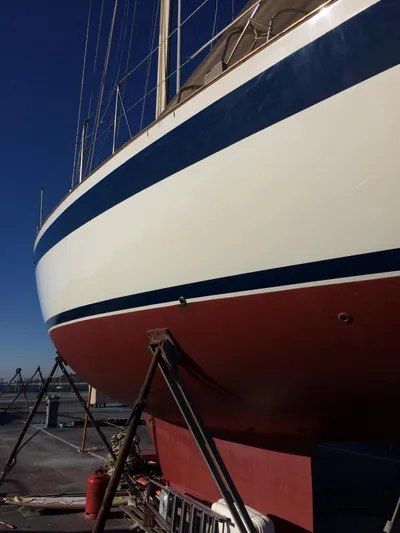 Challenger Yacht Photos Pics 1992 Hallberg-Rassy 45 sailboat on dry dock, showcasing hull and keel.