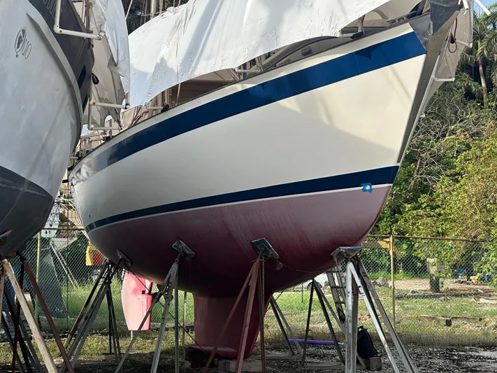 Challenger Yacht Photos Pics Sailboat Hallberg-Rassy 45, 1992 model, on stands for maintenance.