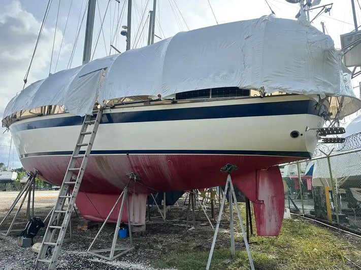 Challenger Yacht Photos Pics 1992 Hallberg-Rassy 45 sailboat on stands, covered, with ladder access.