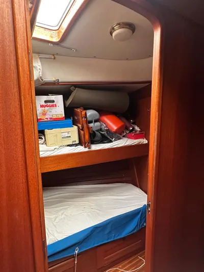 Challenger Yacht Photos Pics Interior cabin of 1992 Hallberg-Rassy 45 yacht with storage and bunk bed.