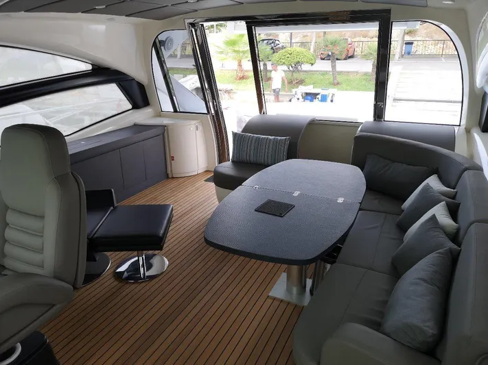  Yacht Photos Pics Luxurious interior of a 2007 Pershing 62 yacht with elegant seating and modern design.