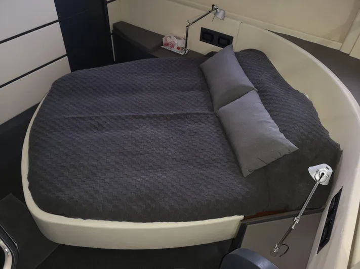  Yacht Photos Pics Luxurious bedroom interior of 2007 Pershing 62 yacht with modern bedding.