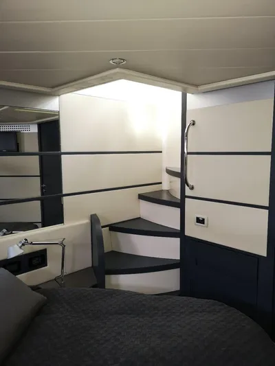  Yacht Photos Pics Interior of 2007 Pershing 62 yacht with modern staircase and sleek design.