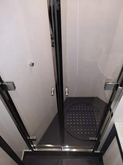  Yacht Photos Pics Shower area in 2007 Pershing 62 yacht with glass doors and modern design.