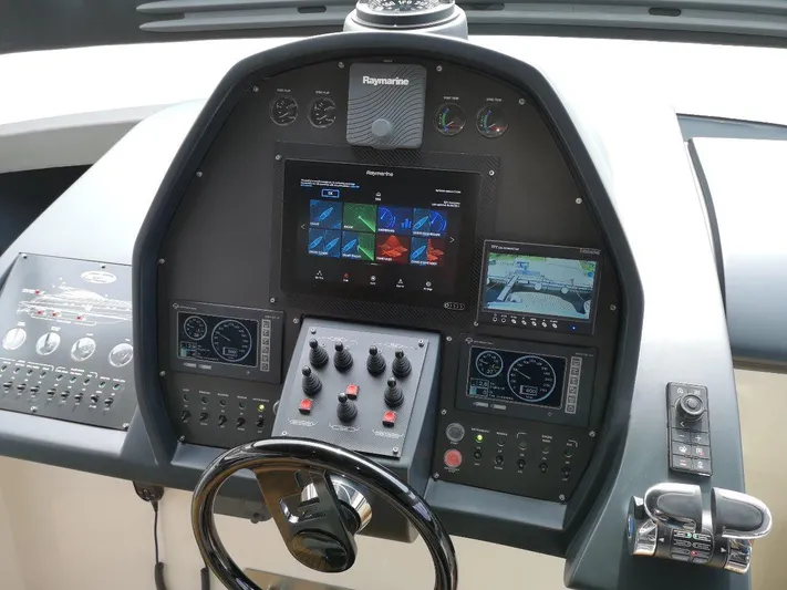  Yacht Photos Pics Control panel of a 2007 Pershing 62 yacht with navigation and monitoring systems.