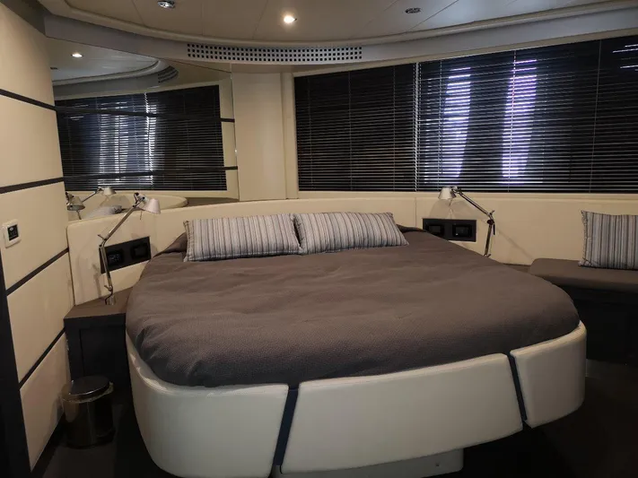  Yacht Photos Pics Luxurious bedroom interior of 2007 Pershing 62 yacht with modern design and cozy bedding.