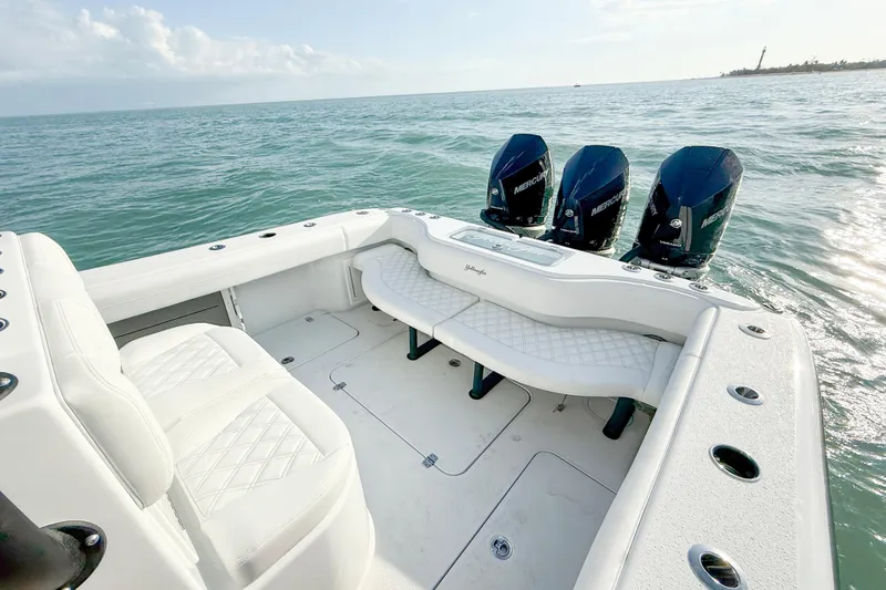  Yacht Photos Pics 2026 Yellowfin 34 Offshore boat with triple Mercury engines on open water.
