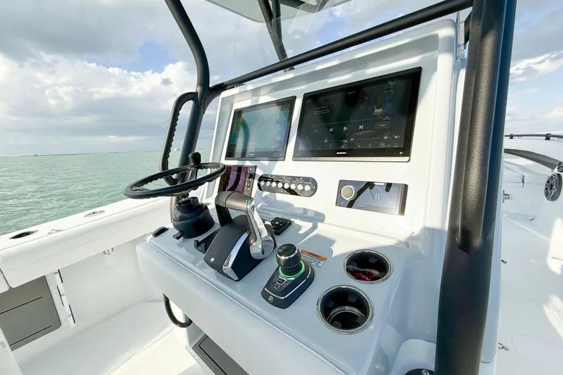  Yacht Photos Pics 2026 Yellowfin 34 Offshore boat dashboard with modern controls and dual screens.