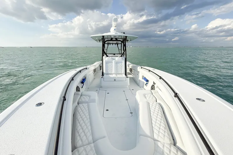  Yacht Photos Pics 2026 Yellowfin 34 Offshore boat on open water under cloudy sky.