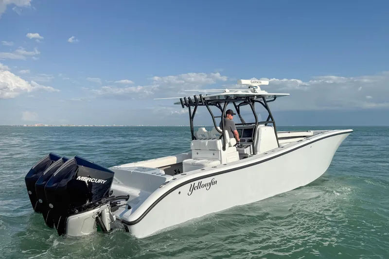  Yacht Photos Pics 2026 Yellowfin 34 Offshore boat cruising on open water with Mercury engines.