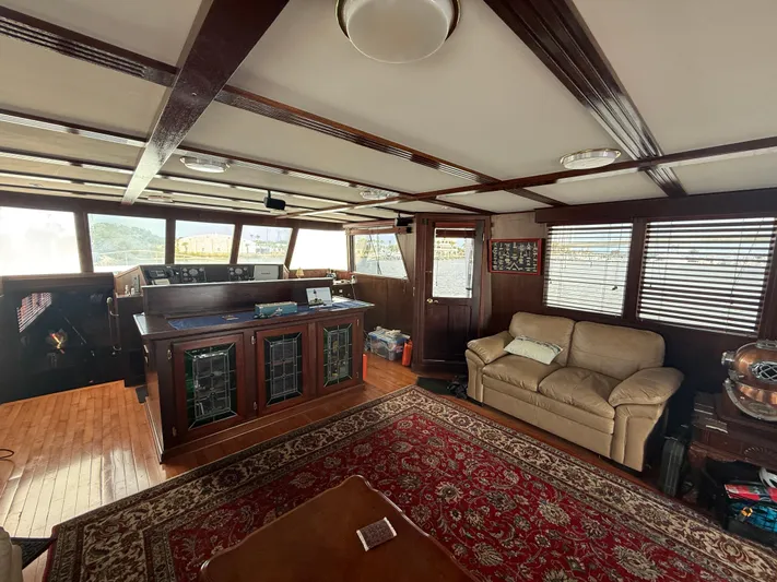  Yacht Photos Pics Luxurious interior of a 2000 Pluckebaum Custom yacht with elegant wood finishes.