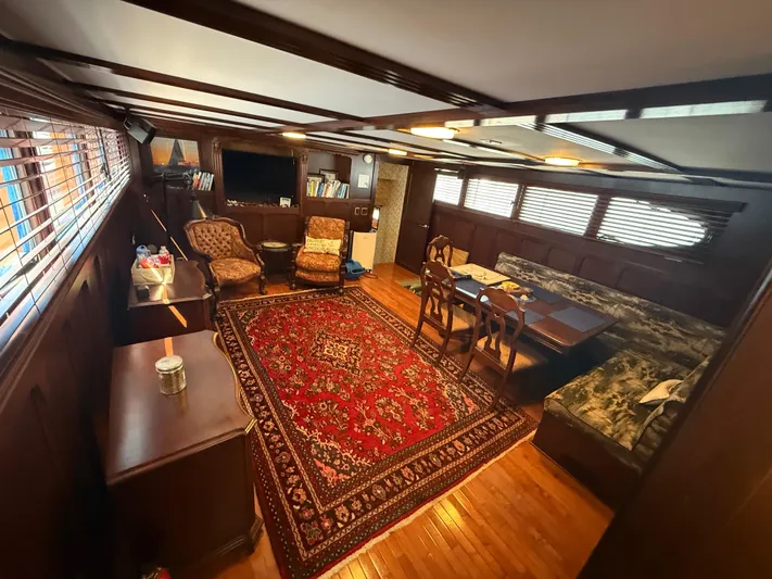  Yacht Photos Pics Luxurious 2000 Pluckebaum Custom yacht interior with elegant wood paneling and plush seating.