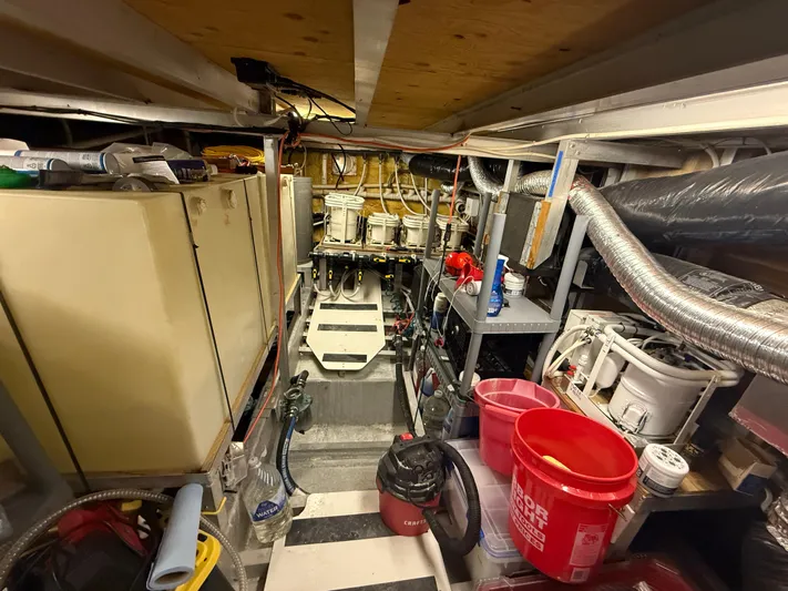  Yacht Photos Pics Engine room of a 2000 Pluckebaum Custom boat, featuring equipment and storage.