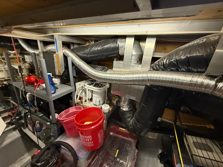  Yacht Photos Pics Engine room of a 2000 Pluckebaum Custom boat with ventilation ducts and equipment.