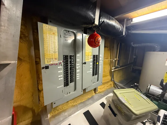  Yacht Photos Pics Electrical panels in a utility room of a 2000 Pluckebaum Custom boat.