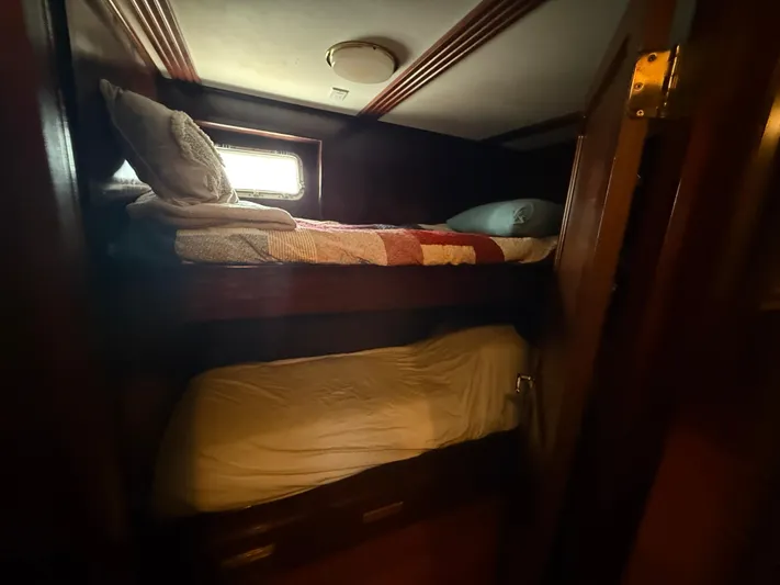  Yacht Photos Pics Bunk beds in a 2000 Pluckebaum Custom boat cabin with wood paneling.
