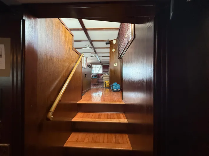  Yacht Photos Pics Interior of 2000 Pluckebaum Custom boat with wooden stairs and handrail.