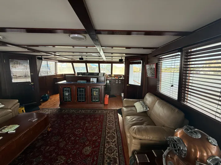  Yacht Photos Pics Luxurious interior of 2000 Pluckebaum Custom yacht with leather seating and panoramic windows.