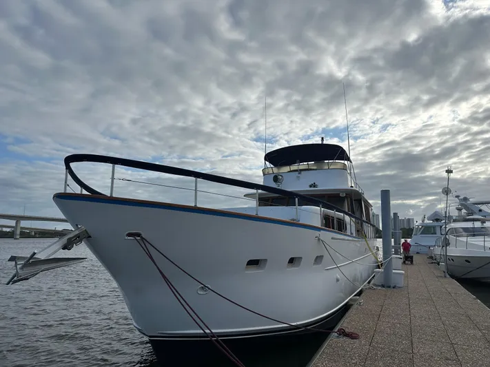  Yacht Photos Pics Luxury Pluckebaum Custom yacht docked, cloudy sky, waterfront view, 2000 model.