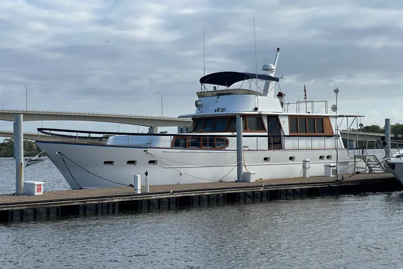  Yacht Photos Pics Luxury 2000 Pluckebaum Custom yacht docked at marina under cloudy sky.