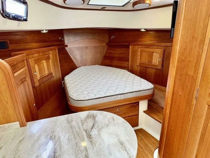 Linda Lou Yacht Photos Pics Interior of a 2018 Legacy 36 yacht with wooden furnishings.