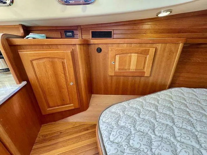 Linda Lou Yacht Photos Pics Interior of a 2018 Legacy 36 yacht with wooden cabinetry.