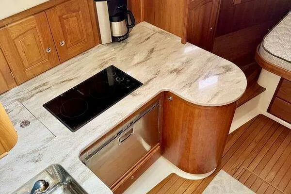 Linda Lou Yacht Photos Pics Kitchen area in 2018 Legacy 36 yacht with stove and dishwasher.