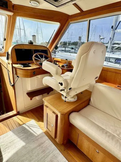 Linda Lou Yacht Photos Pics Interior of a 2018 Legacy 36 yacht with steering wheel and seat.