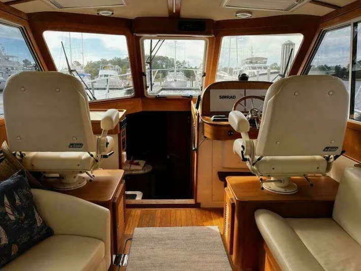 Linda Lou Yacht Photos Pics Interior of a 2018 Legacy 36 yacht with two captain's chairs.