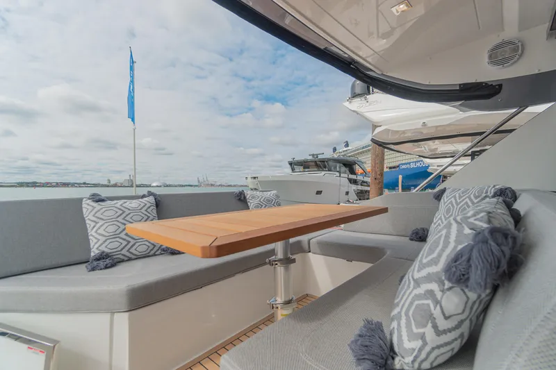 Lady C Yacht Photos Pics Luxurious 2022 Galeon 485 HTS yacht with elegant outdoor seating and stylish cushions.